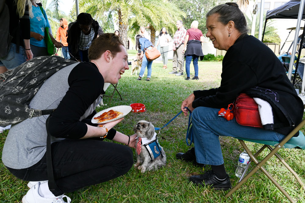 Michael Aldridge pets Lou, owned by Mary Eversmann